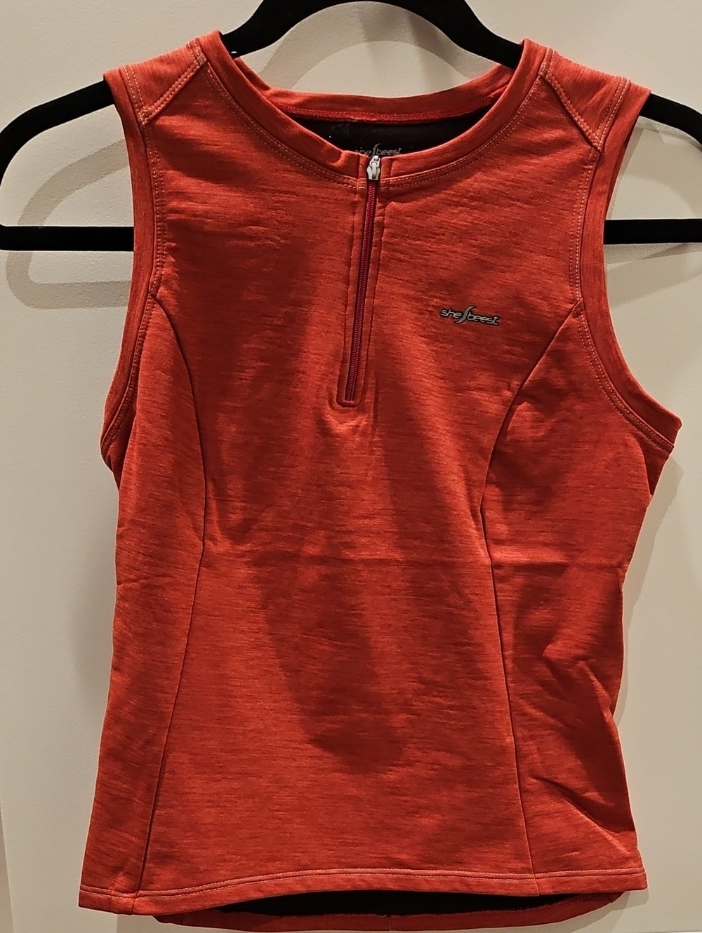 Shebeest Women's Orange Sleeveless 1/4 Zip Jersey Top